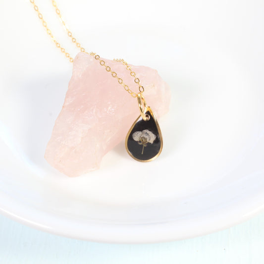 Tiny gold pressed flower necklace, natural white flower, handmade resin pendant, black, botanical jewelry, small, dainty, wildflower, plant