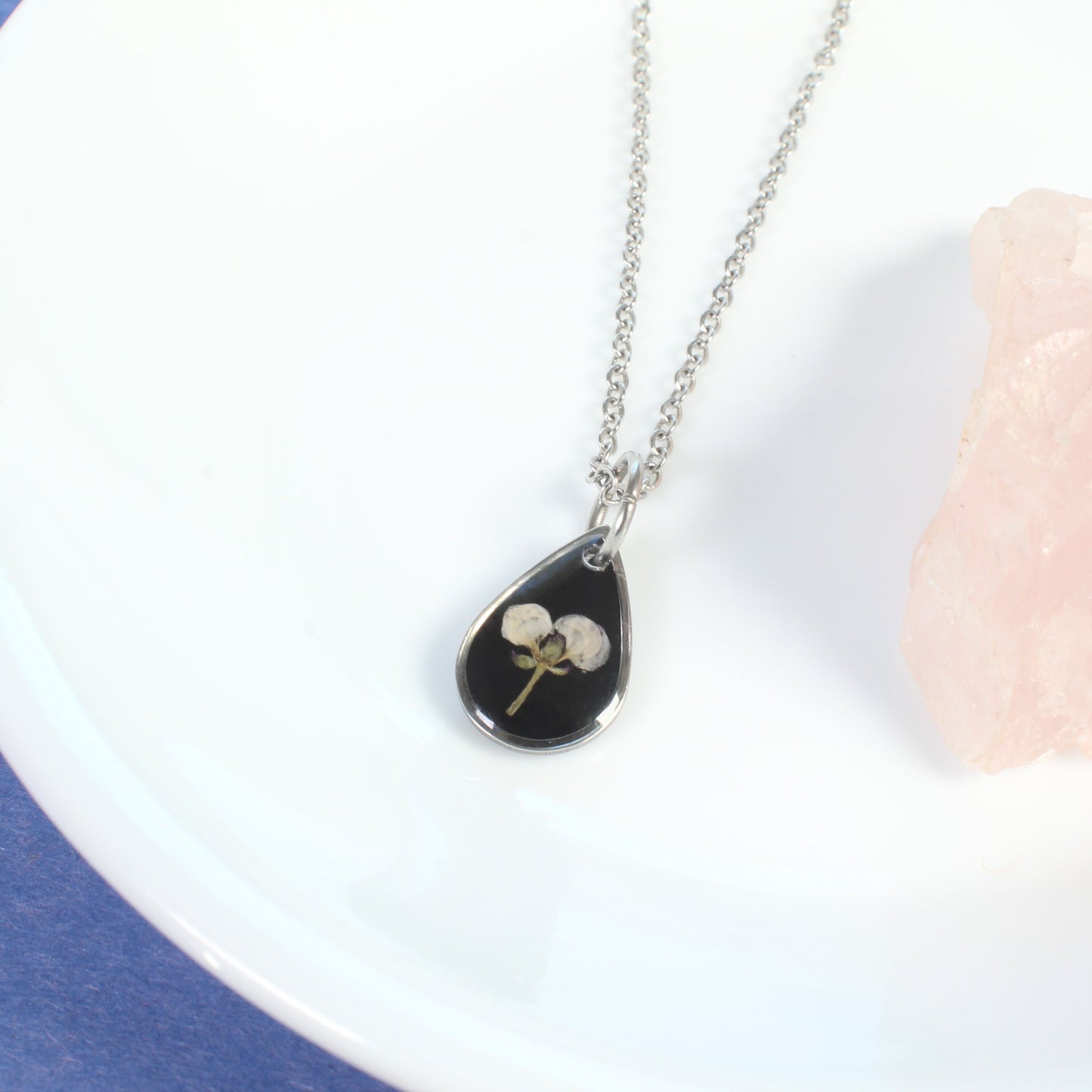 Tiny gold pressed flower necklace, natural white flower, handmade resin pendant, black, botanical jewelry, small, dainty, wildflower, plant